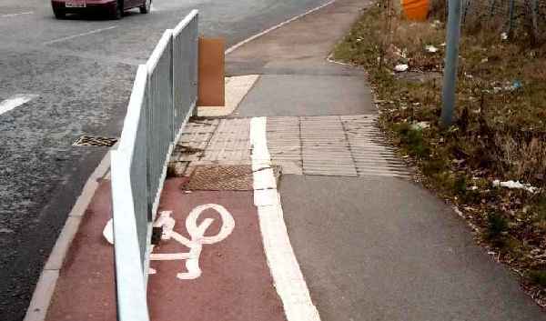 or maybe it is to prevent pedestrians stepping into the path of cyclists?