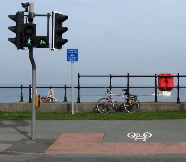 a perfectly good toucan crossing allows cyclist to access the prom ... where cycling is prohibited