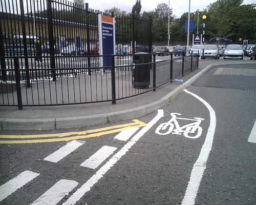 Cycle lane passes through a fence